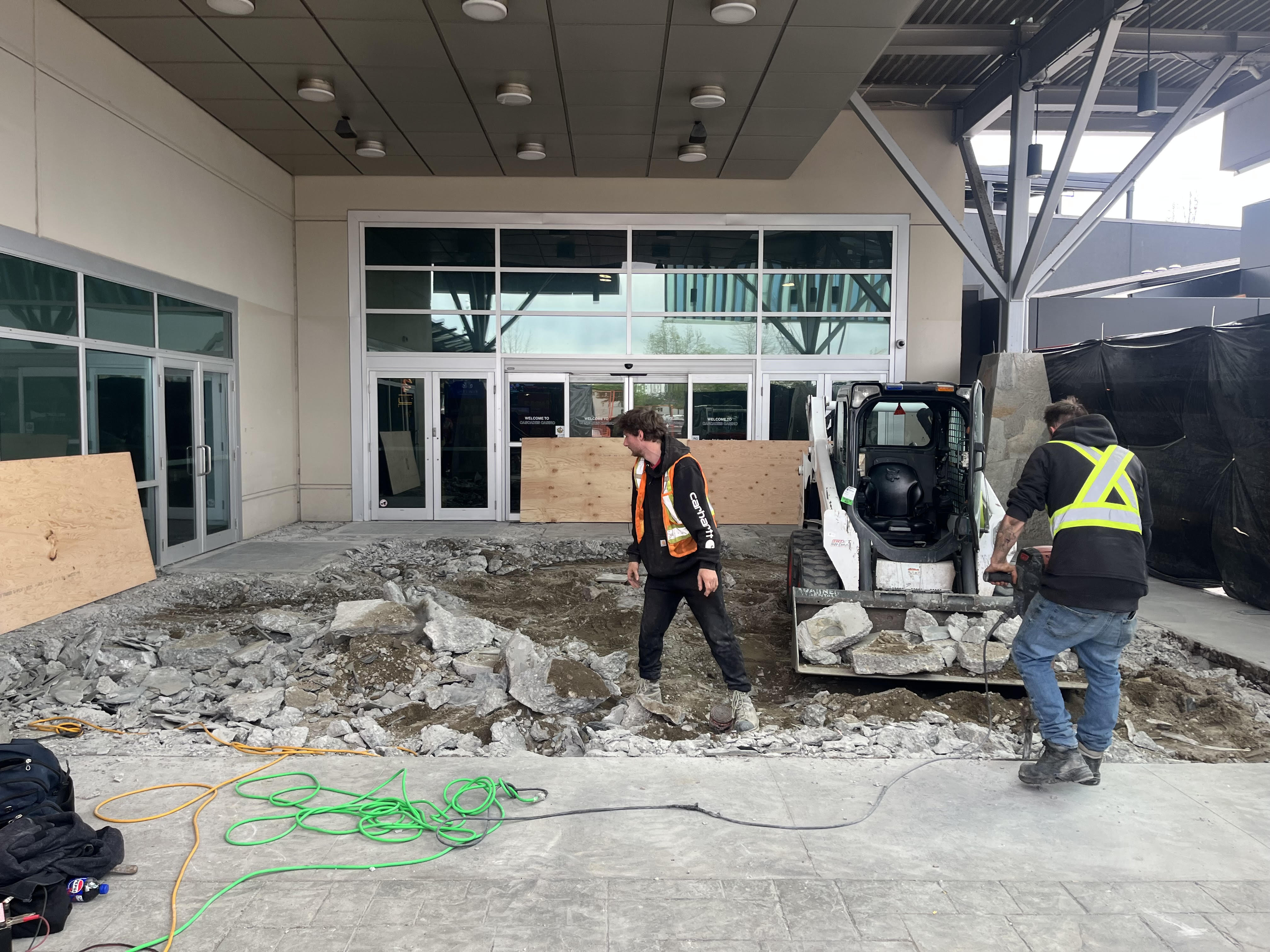 S&K crew removing the old entrance slab with a skid steer at Cascades Casino, Langley